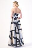 A strapless evening gown with a metallic silver base and bold black geometric patterns