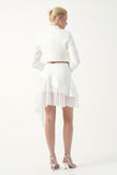 Cropped jacket with an asymmetric layered skirt